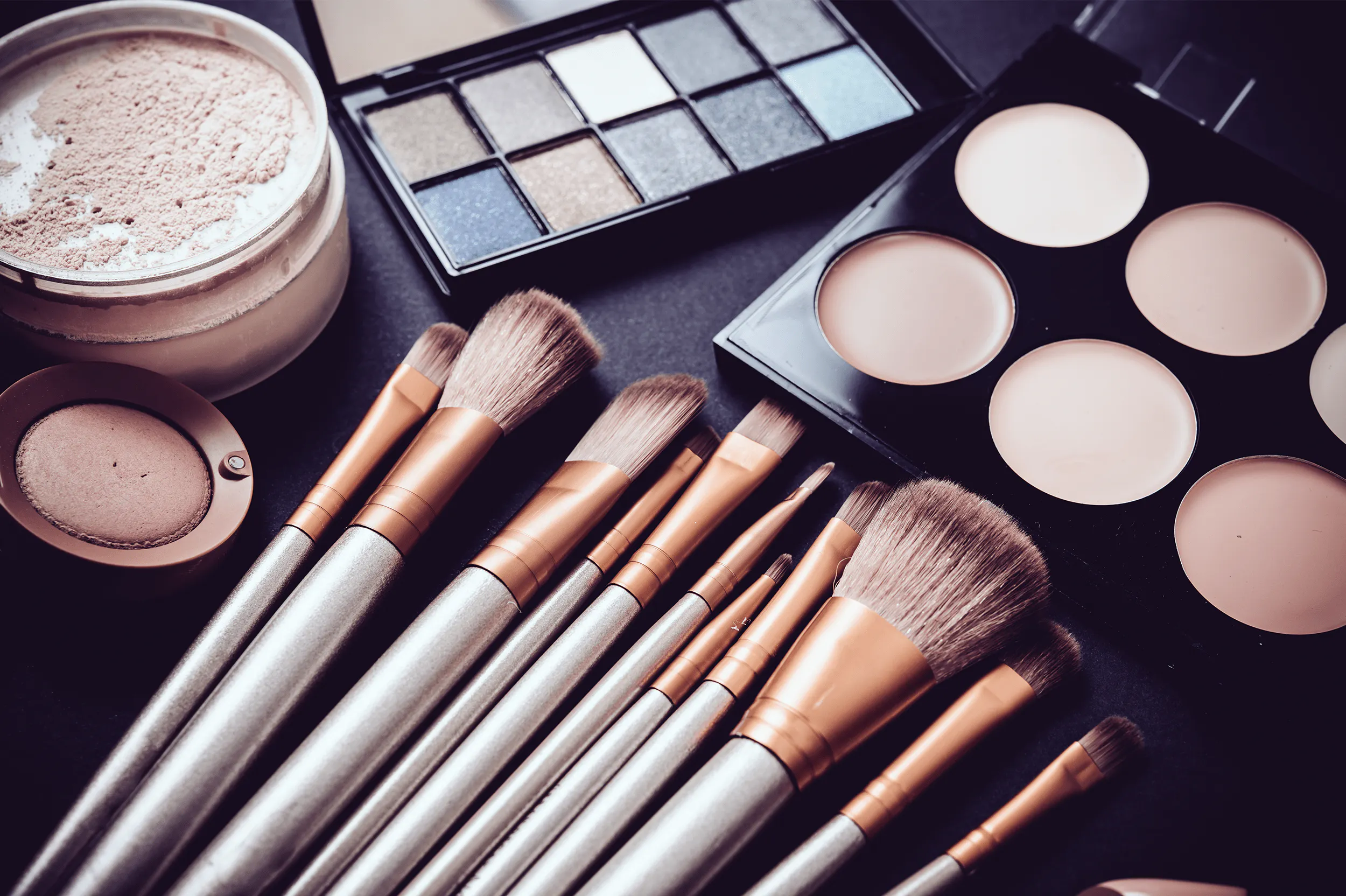 Makeup brushes, color pallets, and foundation